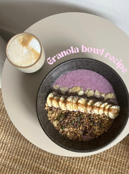 Aesthetic image of a Granola Bowl and a cup of coffee on a coffee table