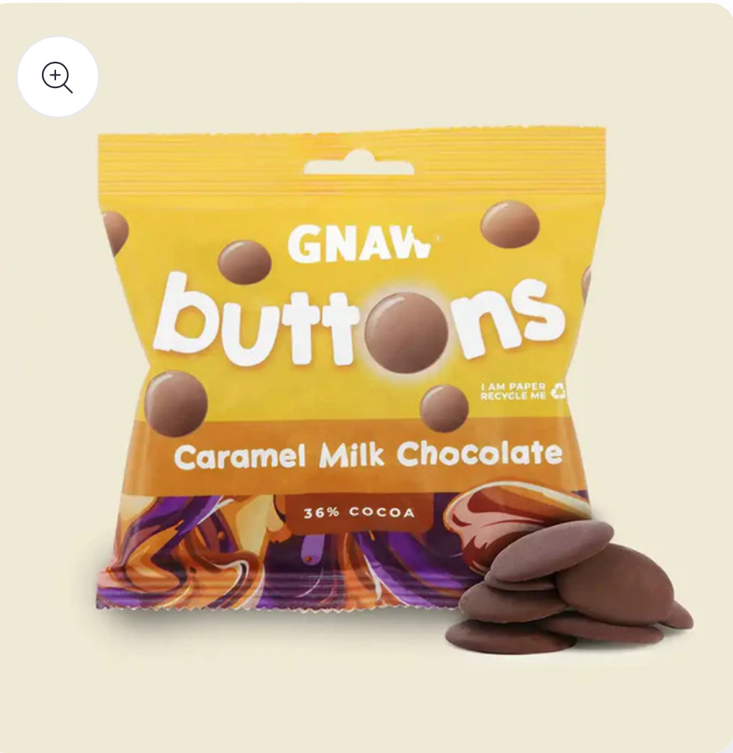 Packaging of GNAW buttons caramel milk chocolate on a beige background